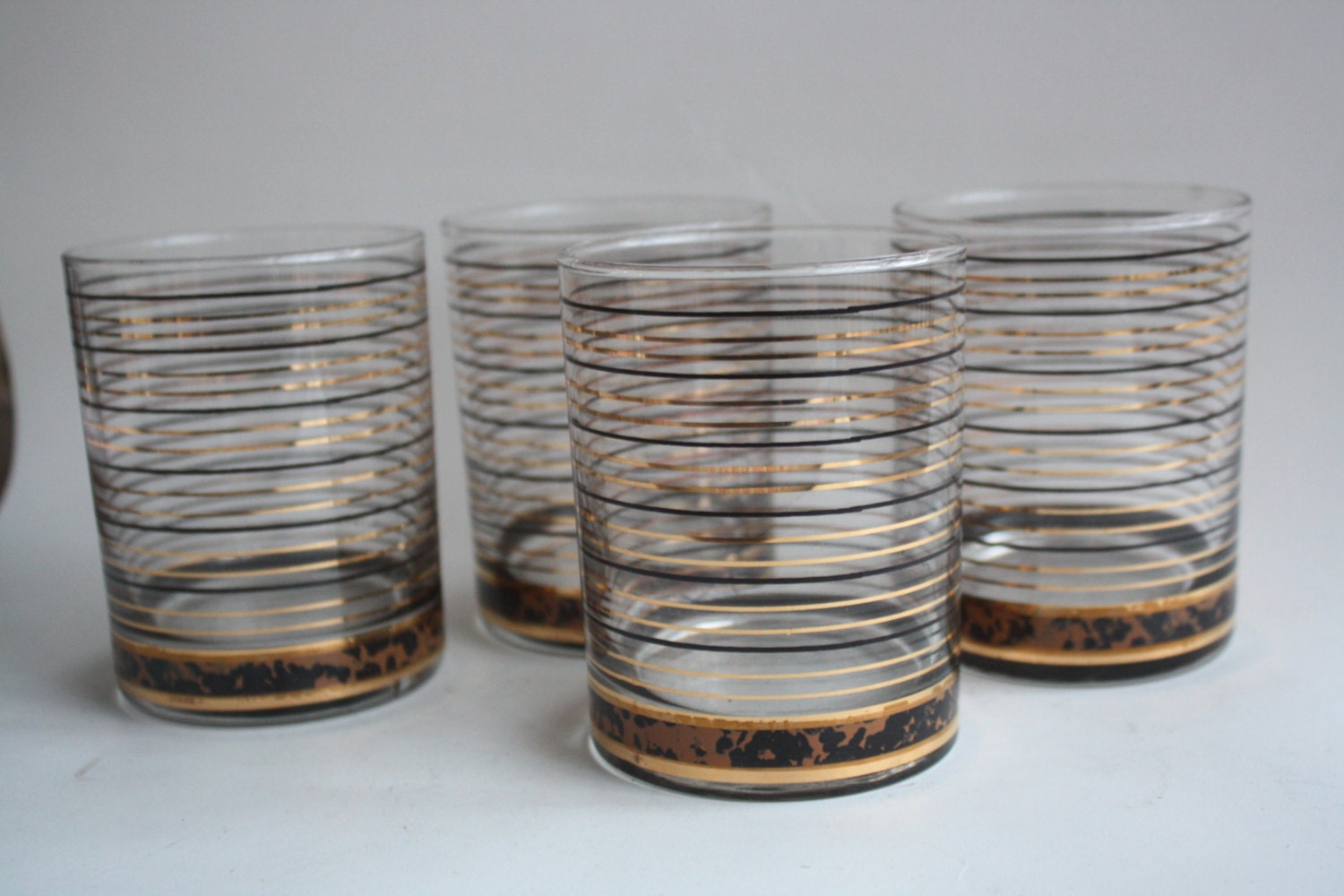Set of 4 Black and Gold Striped Short Tumbler Glasses by gremlina