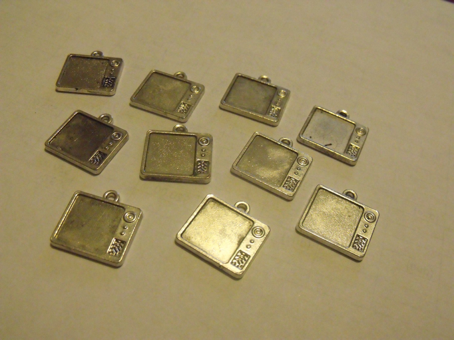 Destash of metal tv charms