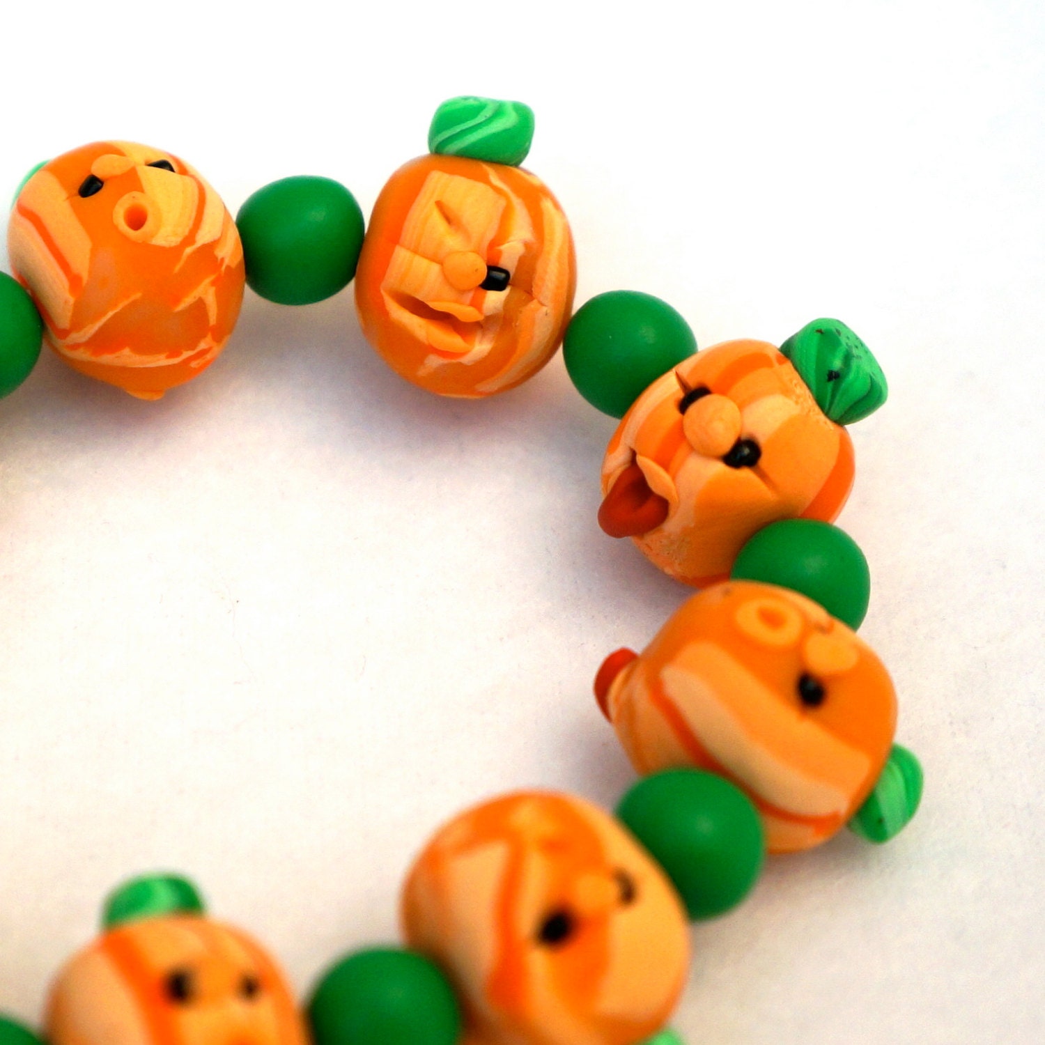 Handmade Halloween Pumpkin Bracelet - Funny Polymer Clay Faces on Every Bead - Orange and Green - Fuffalumps