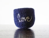 navy blue felted wool bowl with white word 