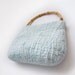 Felted summer handbag with bamboo handle.