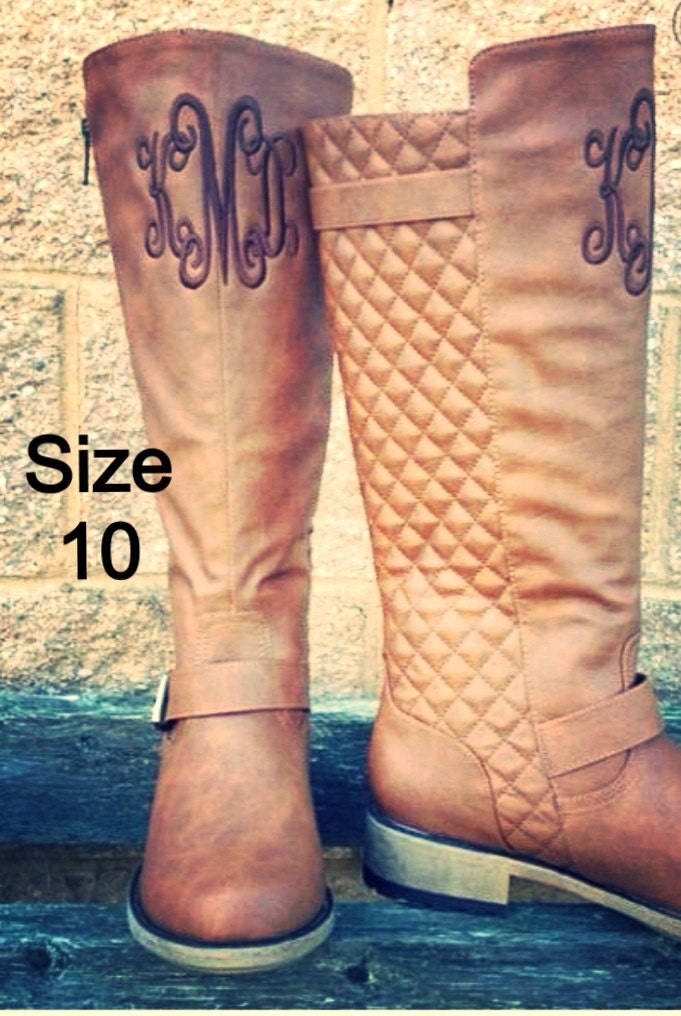 monogram plaque long leather boots