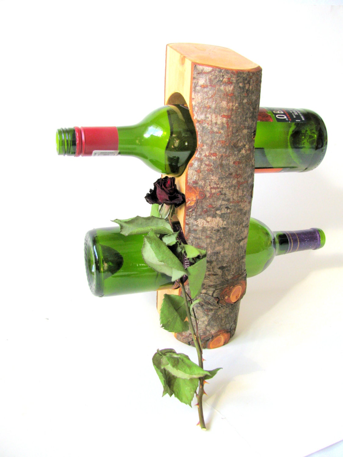 Items similar to Rustic tree log wine rack. on Etsy