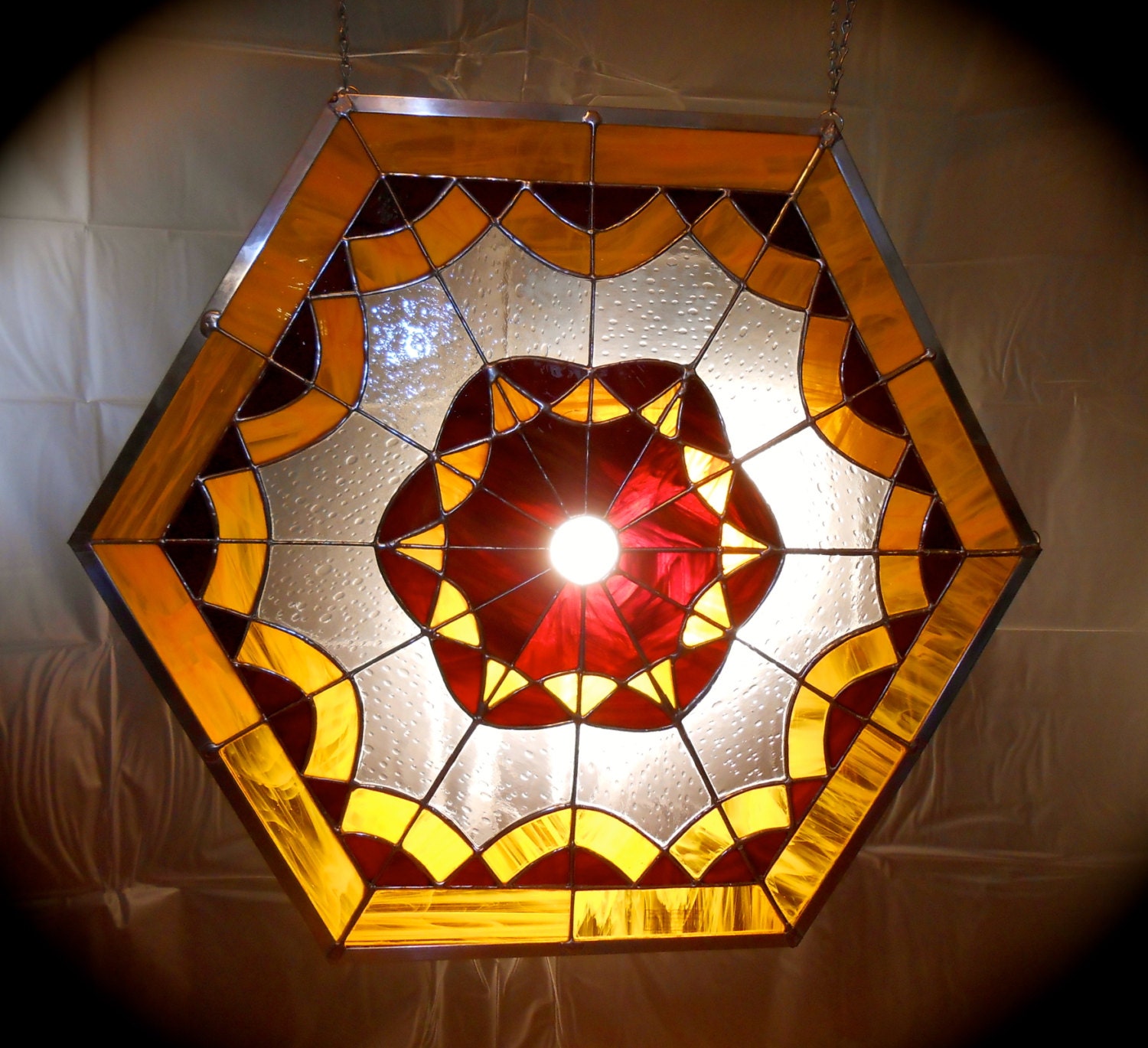 Hexagonal Stained Glass Window Hanging In by PaytonManorDesigns