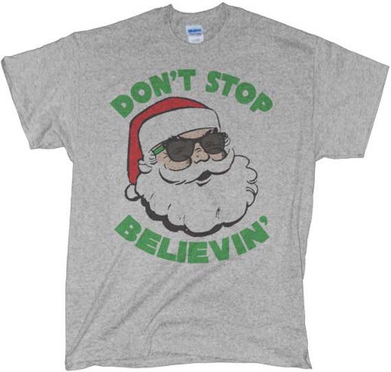 Items similar to Don't Stop Believing Santa Shirt on Etsy