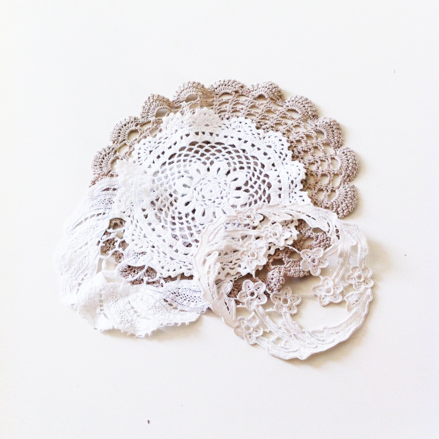 Set of hand embroidered doilies. - DITM