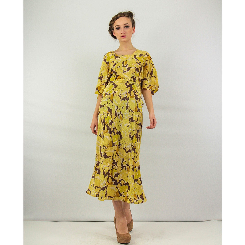 Vintage 1930's silk dress / Yellow floral bias cut ethereal gown with flutter sleeves and peplum waist - CarlaAndCarla