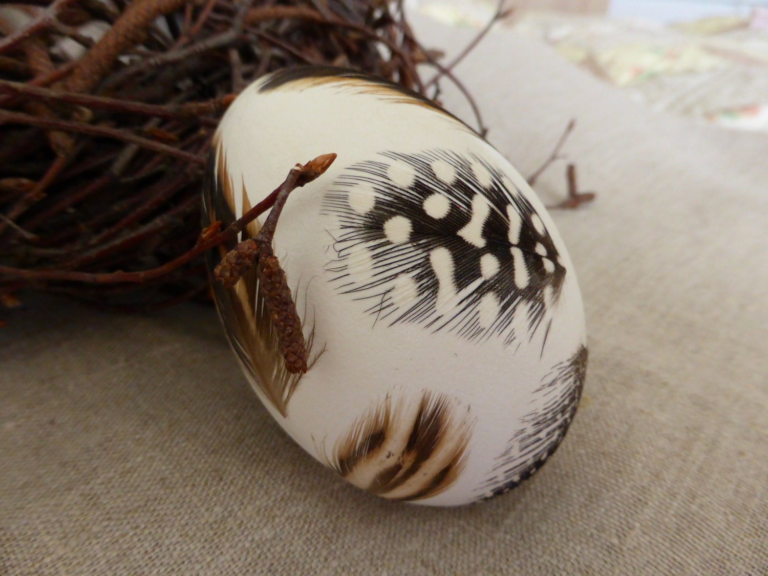 Real goose egg - blown decorated with natural quail feather