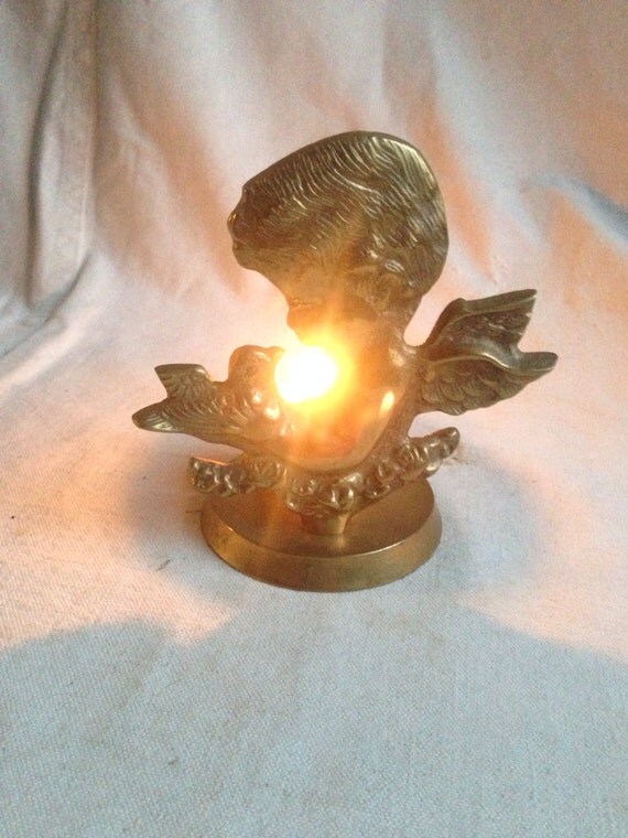 Vintage cherub with bird candle holder brass by yosalvovendo