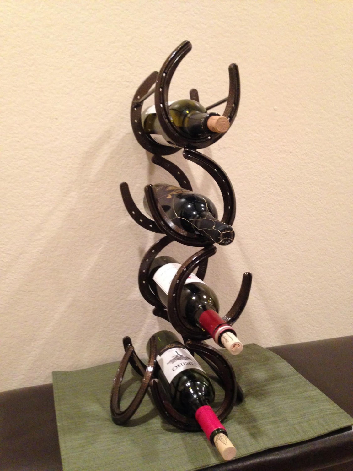 Horseshoe wine rack. This rack holds 4 by TimmyToescustommetal