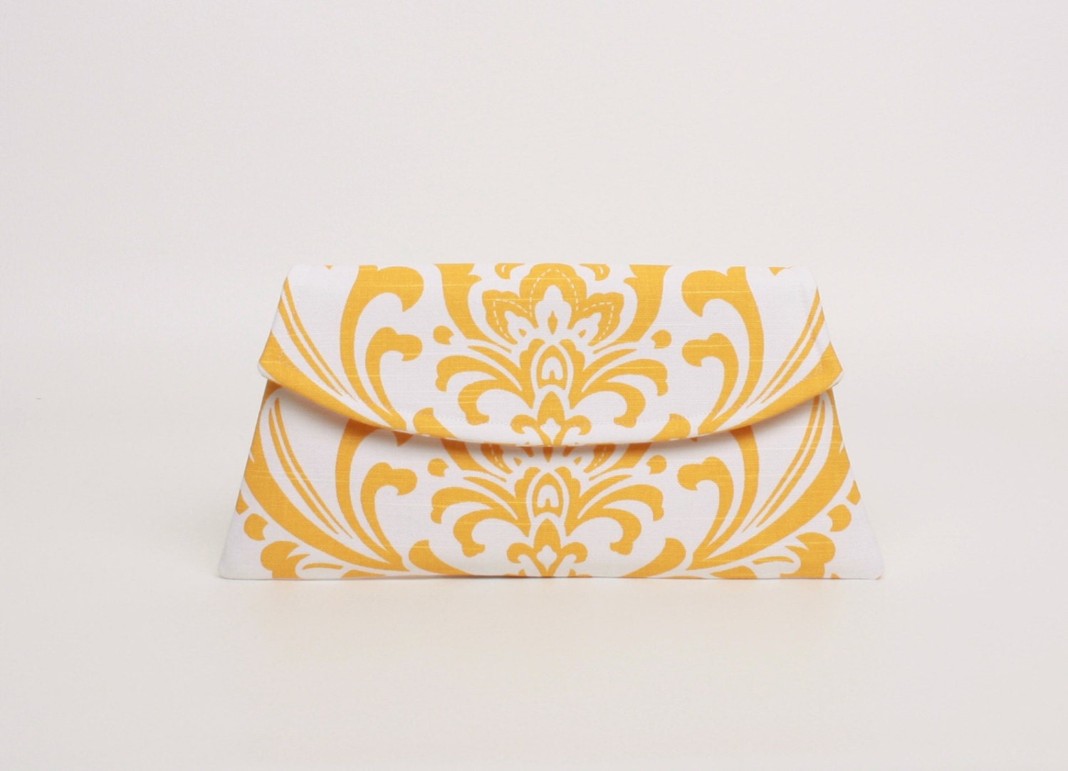 yellow and white clutch