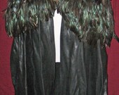 Leather cloak accented with feathers