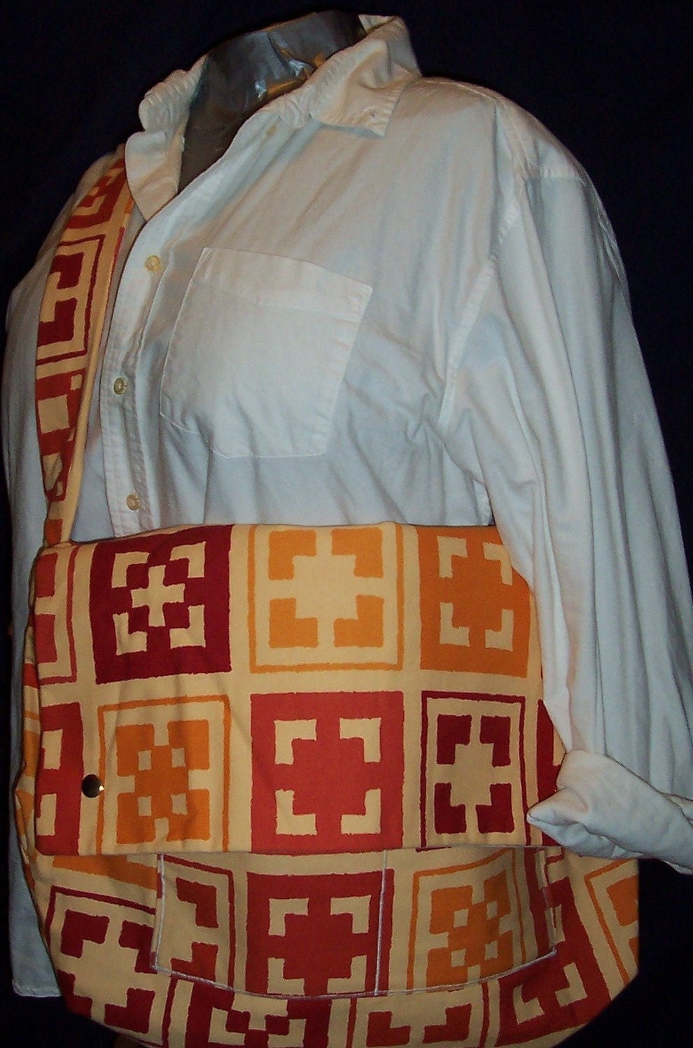 Heather Baby Bag in Red, Gold, Orange Block Print Cotton and a cream canvas lining