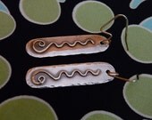 One of a kind Sterling Silver and gold swirl earrings.
