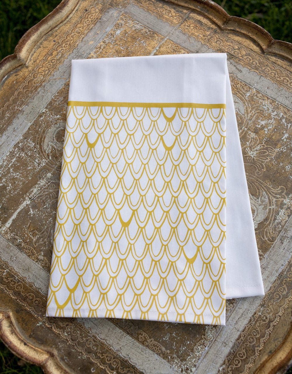 Of a feather . organic tea towel . gold