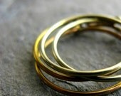 anodized niobium hoops-- yellow gold or copper orange-- handmade by thebeadedlily on etsy