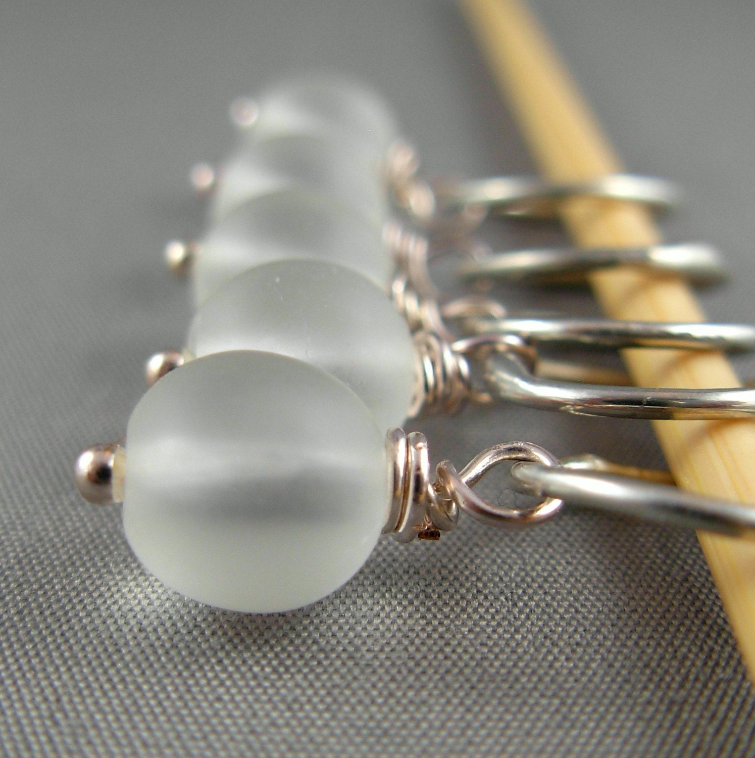 Stitch markers in frosted white glass