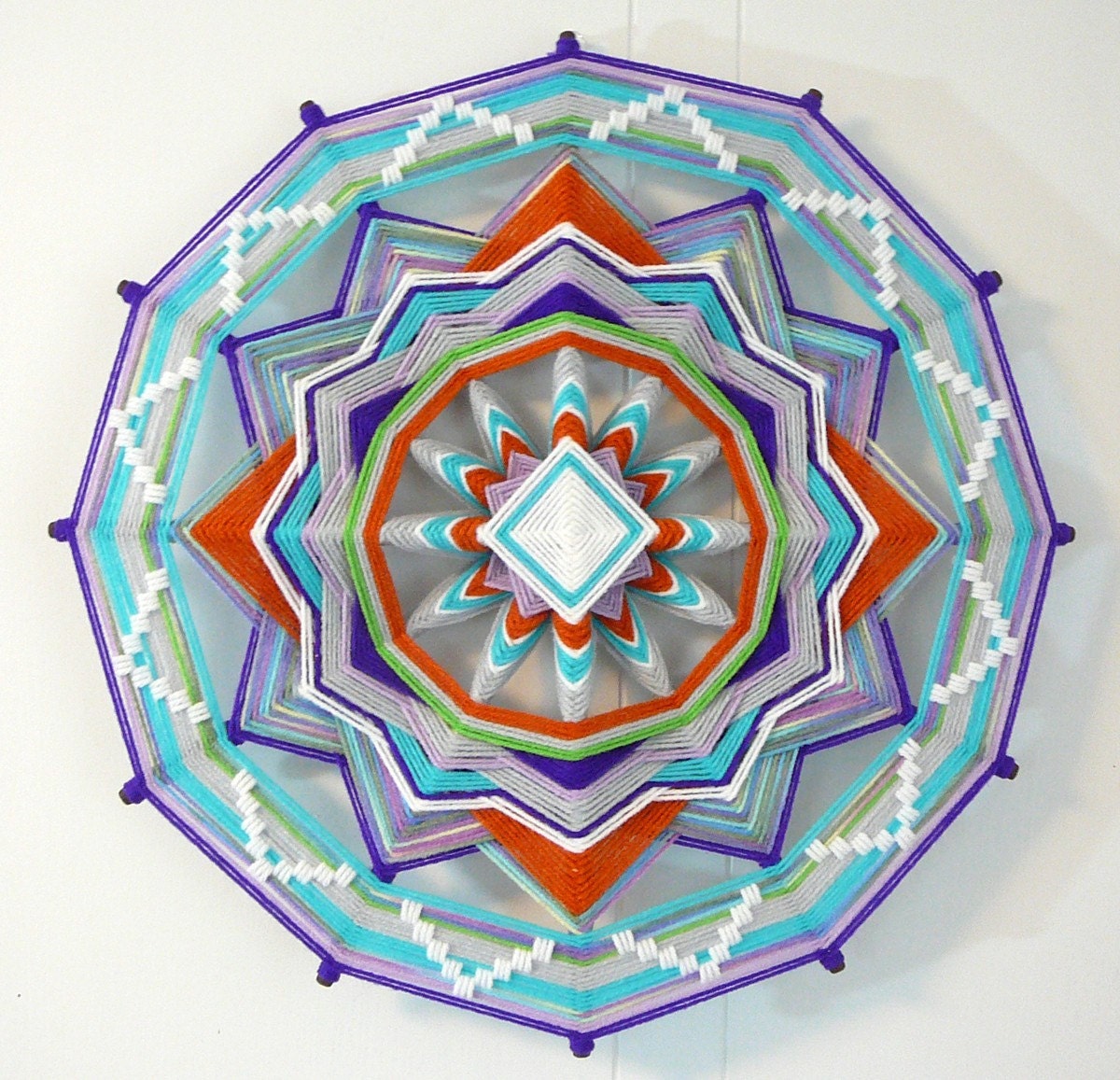 Gray Fox, and 18 inch, 12-sided, Ojo de Dios made with acrylic yarns