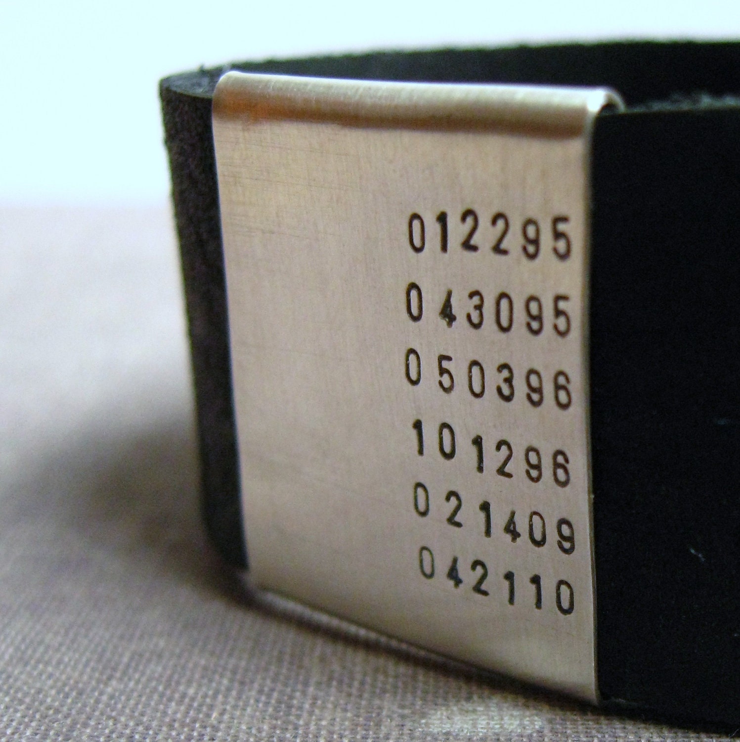 Leather and sterling silver cuff (NUMBERS)