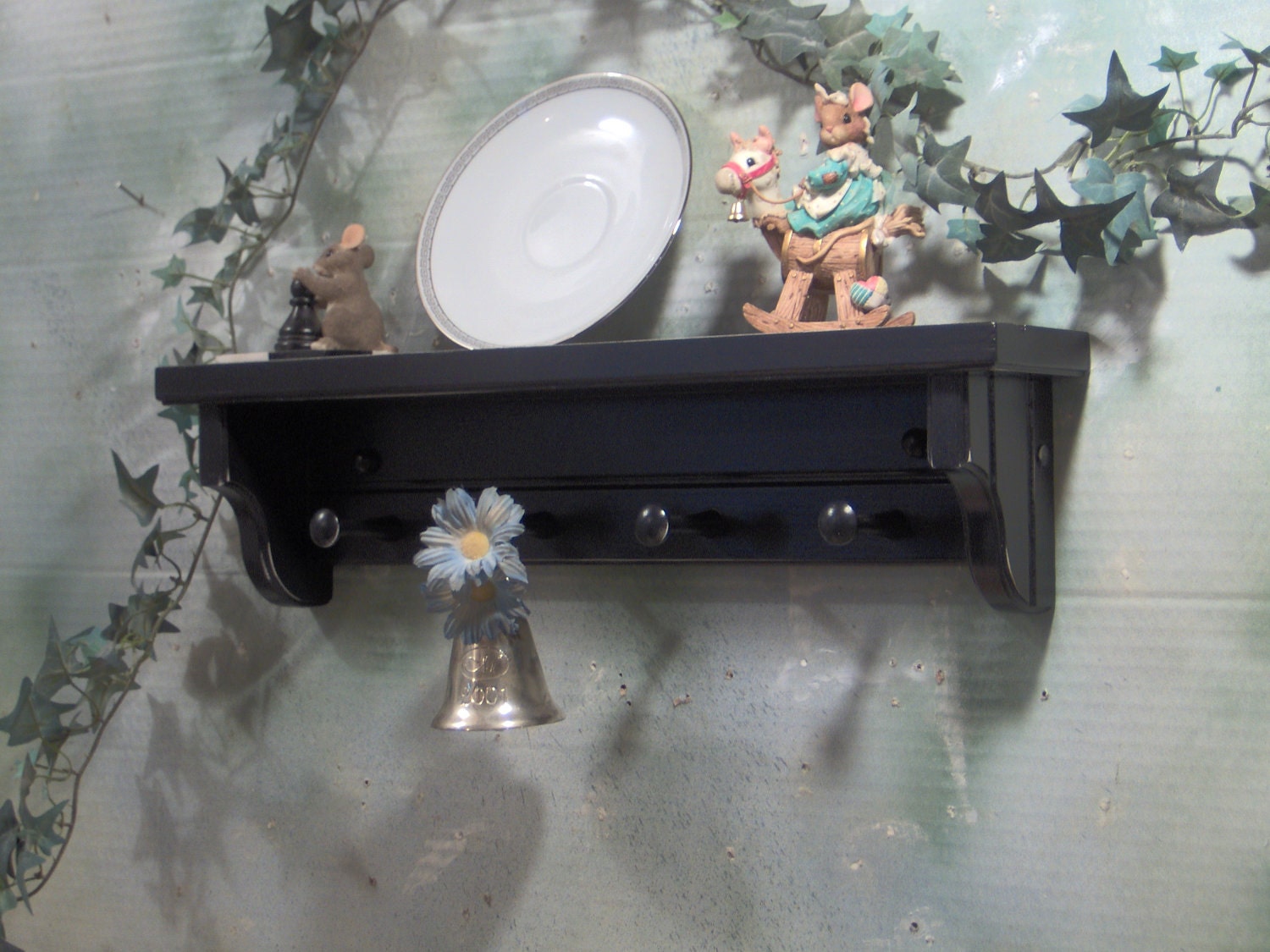 22" Black wooden shelf for knik knack, plates / pegs