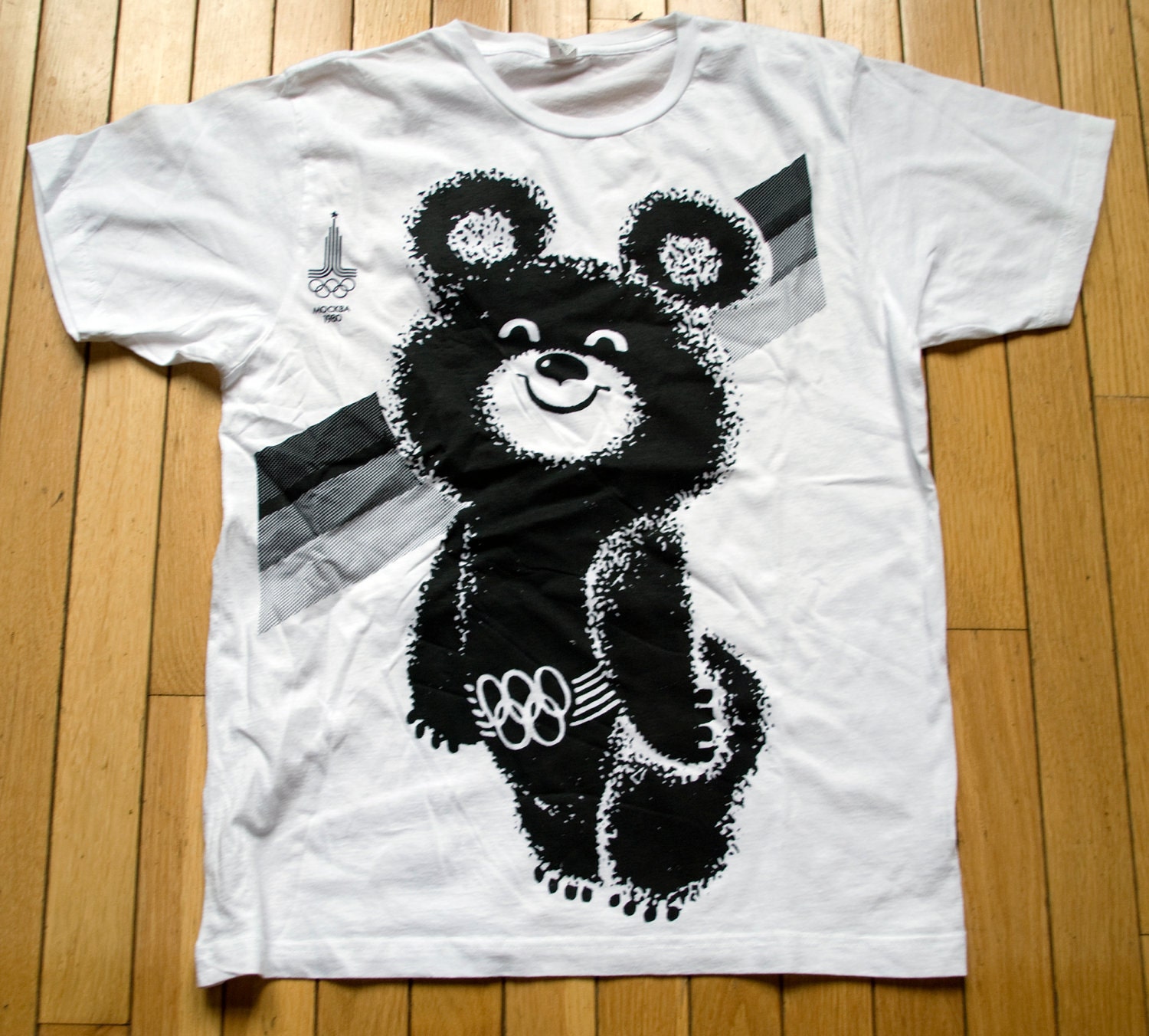 White Tee with black silkscreen image of Misha the mascot of the 1980 Moscow Olympic Games SIZE MEDIUM