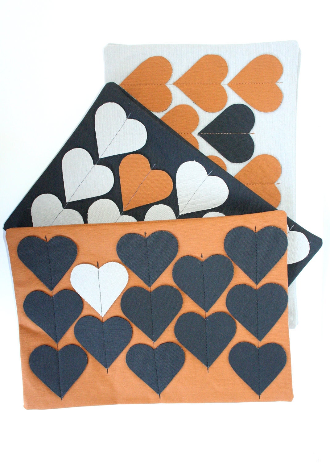 Heartstrings zipper clutch purse in Black with Grey/Nutmeg hearts.