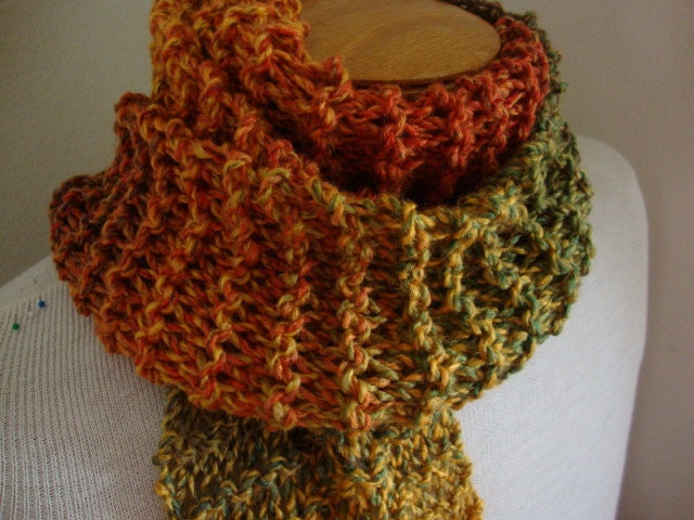 Watercolors, hand knit acrylic scarf in arizona desert red orange green and gold, with tassel fringe