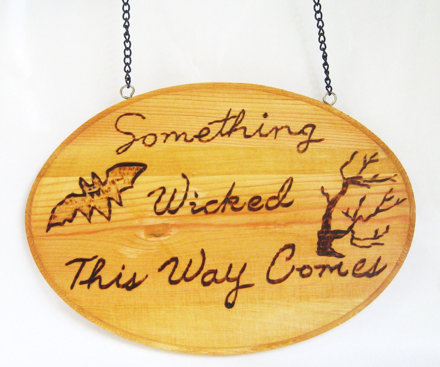 Rustic wood burned Halloween decoration.Something Wicked this way comes