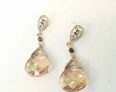 Matte gold vermeil earring with paisley design and sterling silver post with a champagne colored swarovski crystal briolette