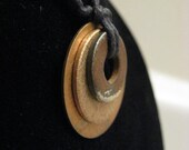 urban artifact necklace with stacked copper, bronze, and rusty washers