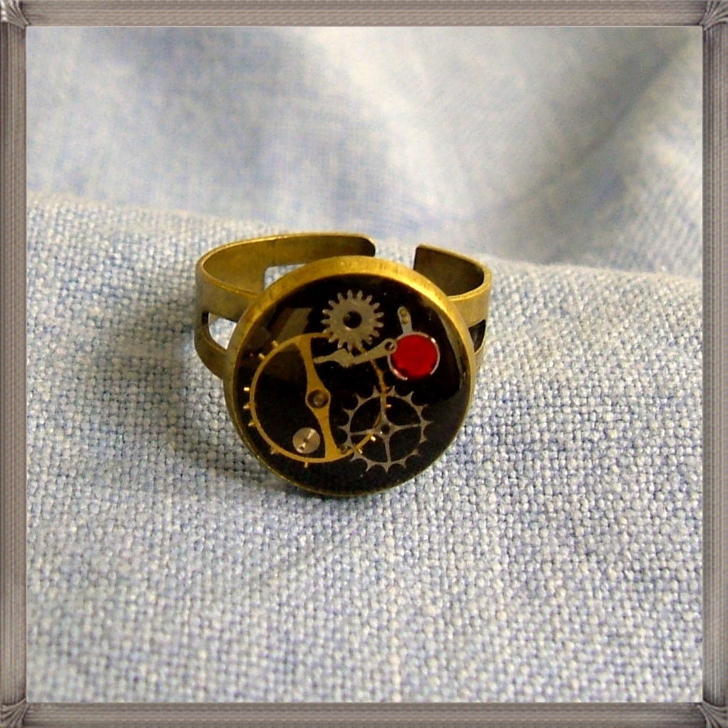 Steampunk  ring with cogs and red crystal