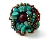 Beaded ring. Turquoise green, teal and brown freeform ring, with turquoise green semiprecious stone