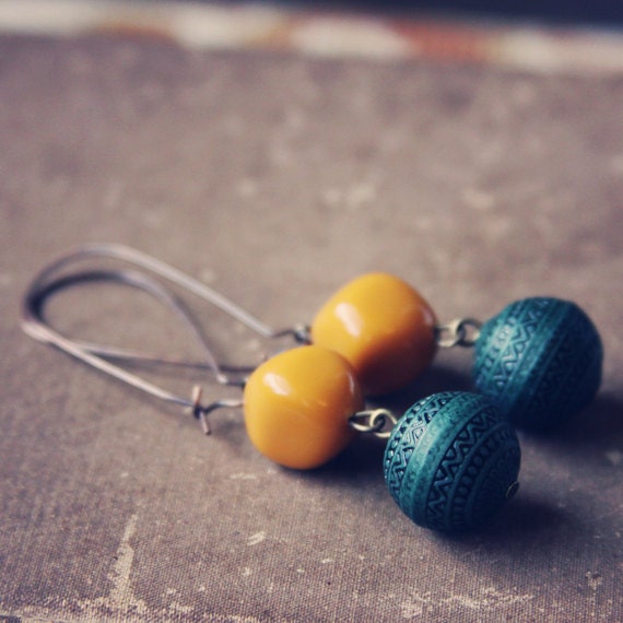 fern.  a pair of evergreen and mustard beaded earrings.