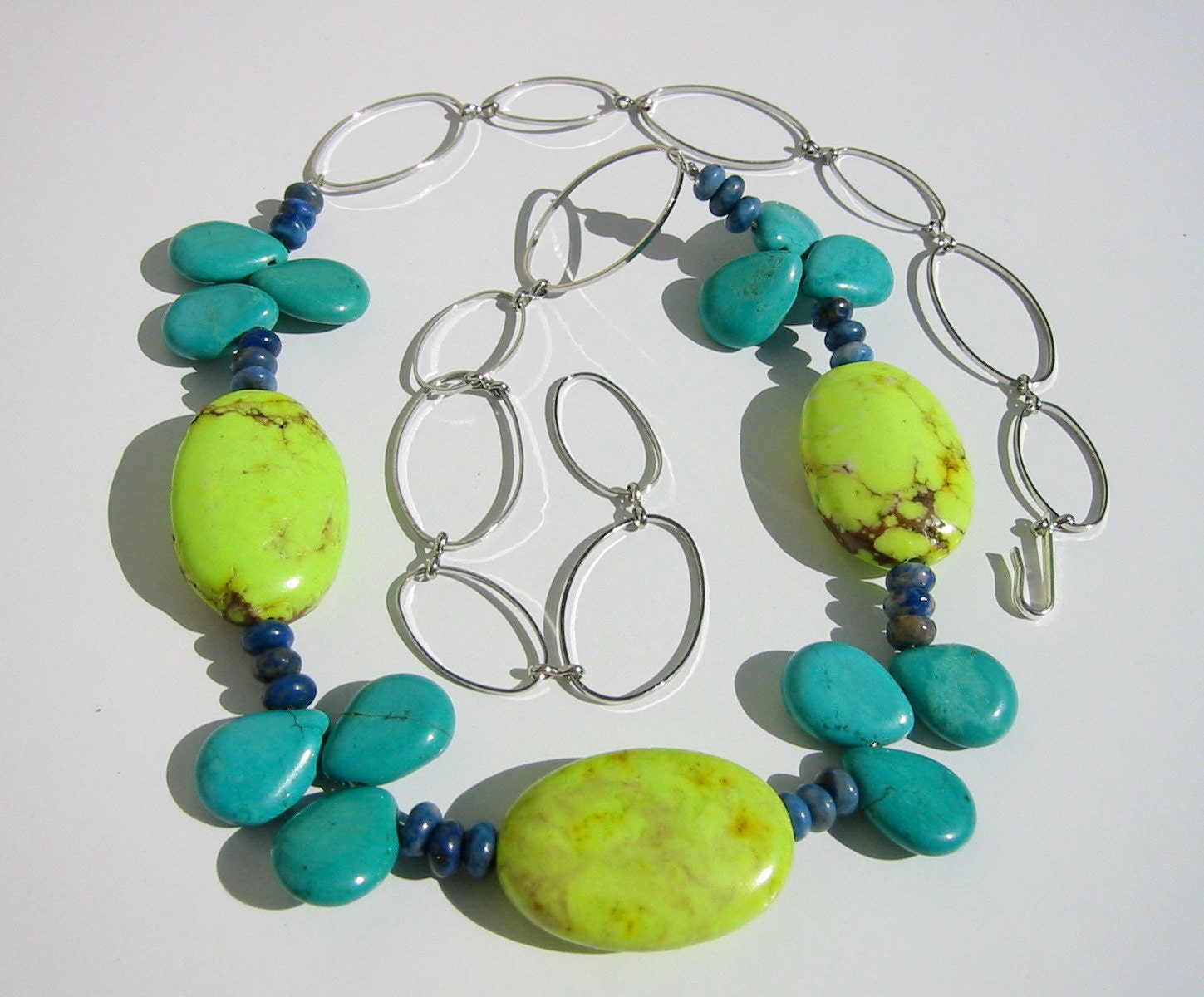 Blue gemstone necklace with turquoise, lime green magnesite, lapis lazuli and large silver chain
