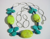 Blue gemstone necklace with turquoise, lime green magnesite, lapis lazuli and large silver chain