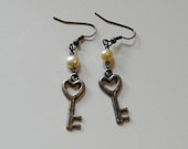 Heart shaped key charm earrings with yellow freshwater pearls and smoky grey seed beads