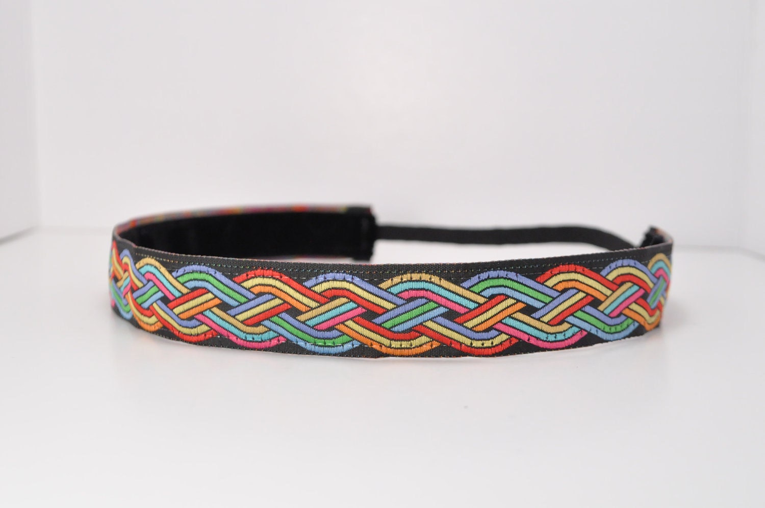 Band-It Headband.... Rainbow Links.  Will stay put and not slip.