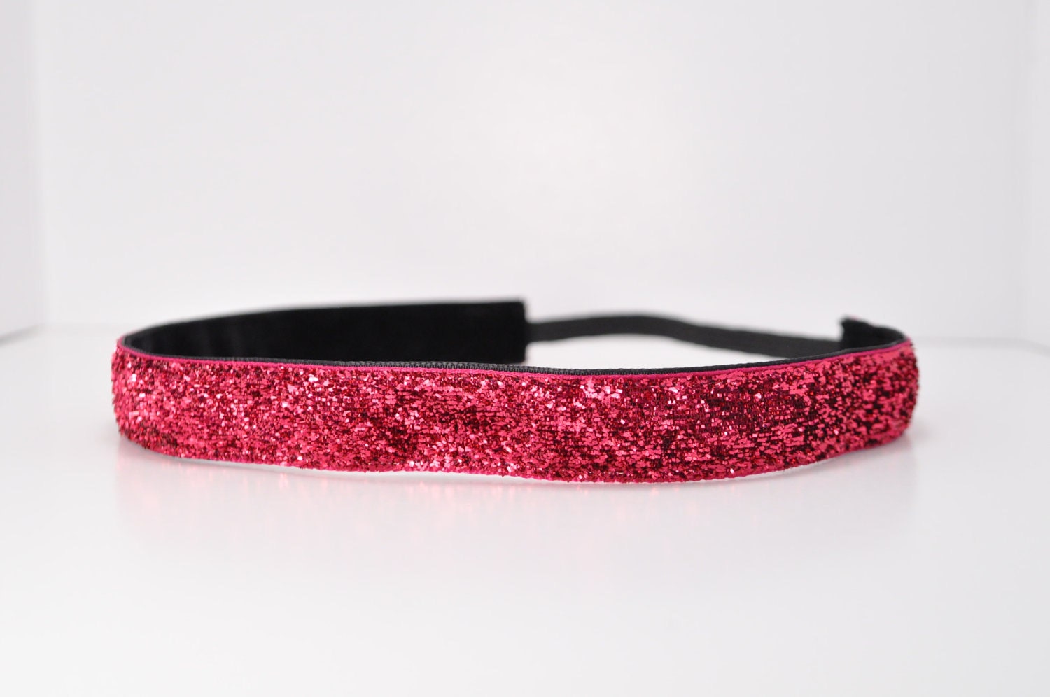 Band-It Headband.... Bright Pink Glitter.  Will stay put and not slip.