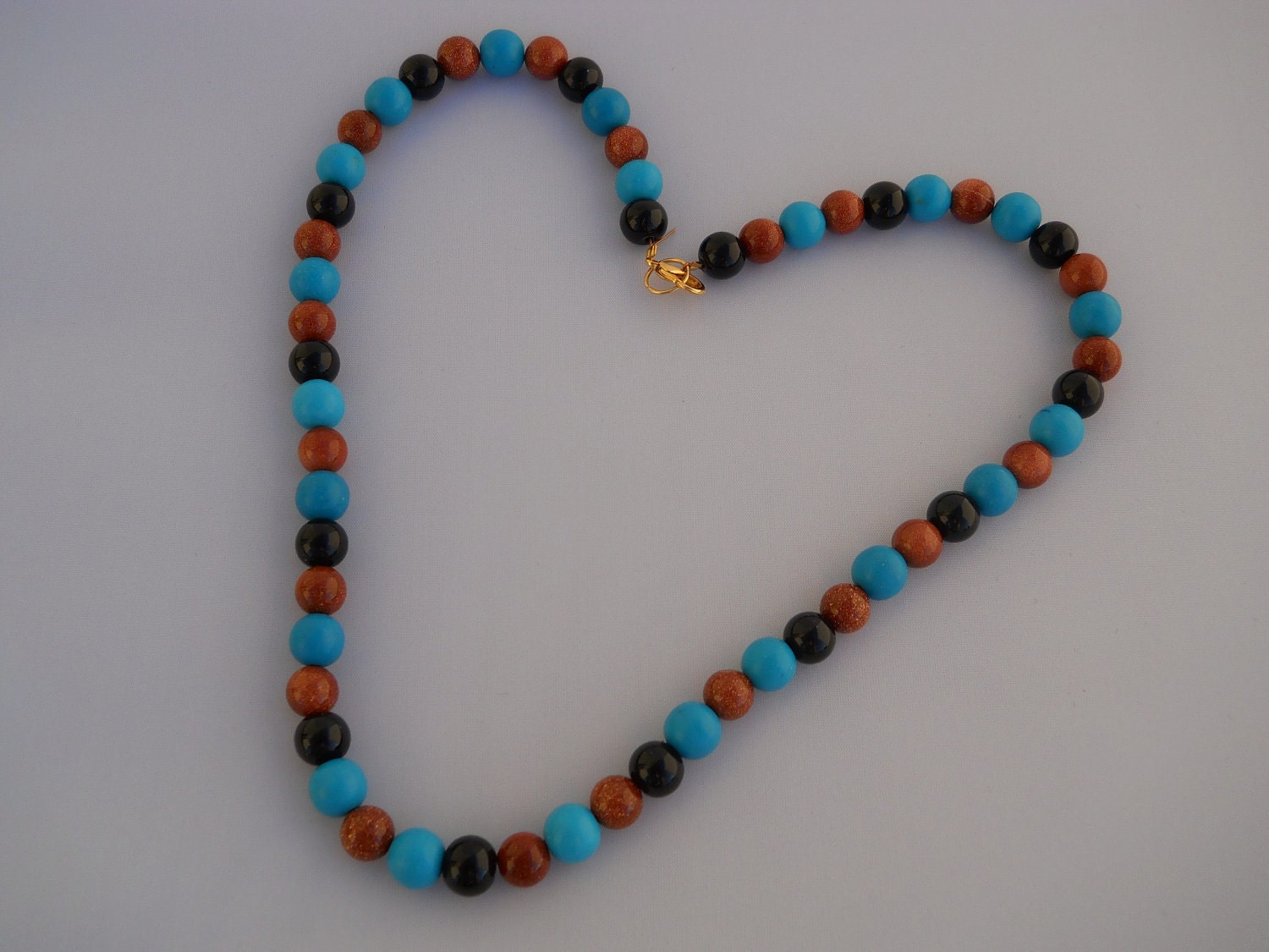 chalk turquoise, goldstone, black glass pearl necklace