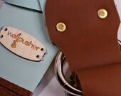leather guitar strap in light blue on brown