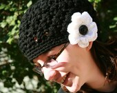 Ladies Black tam beret crocheted with beautiful white flower an accented with large textured black button.