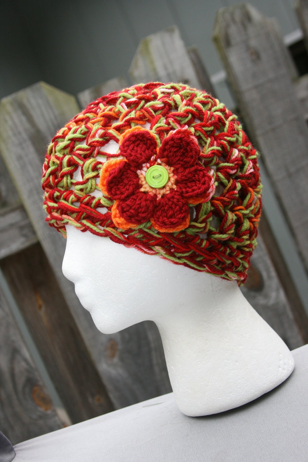 Ladies Cloche hat crochet flower and button accent hat in beautiful  colors of red, orange, and green.