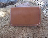 Brown leather credit card or business card wallet with white thread