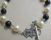 UNIQUE black and ivory glass pearl bracelet with key and lock toggle clasp. Available in other colours. Add a charm in for FREE.