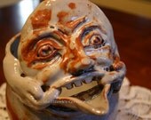 Gargoyle Face Pitcher in Shino Glaze White and Brown