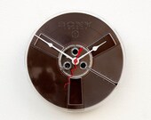 Clock made from a recycled magnetic tape reel