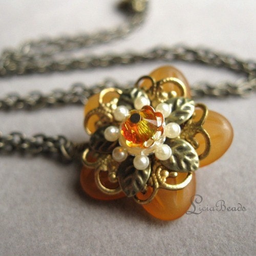 Orange flower pendant with gold filigree and a swarovski crystal