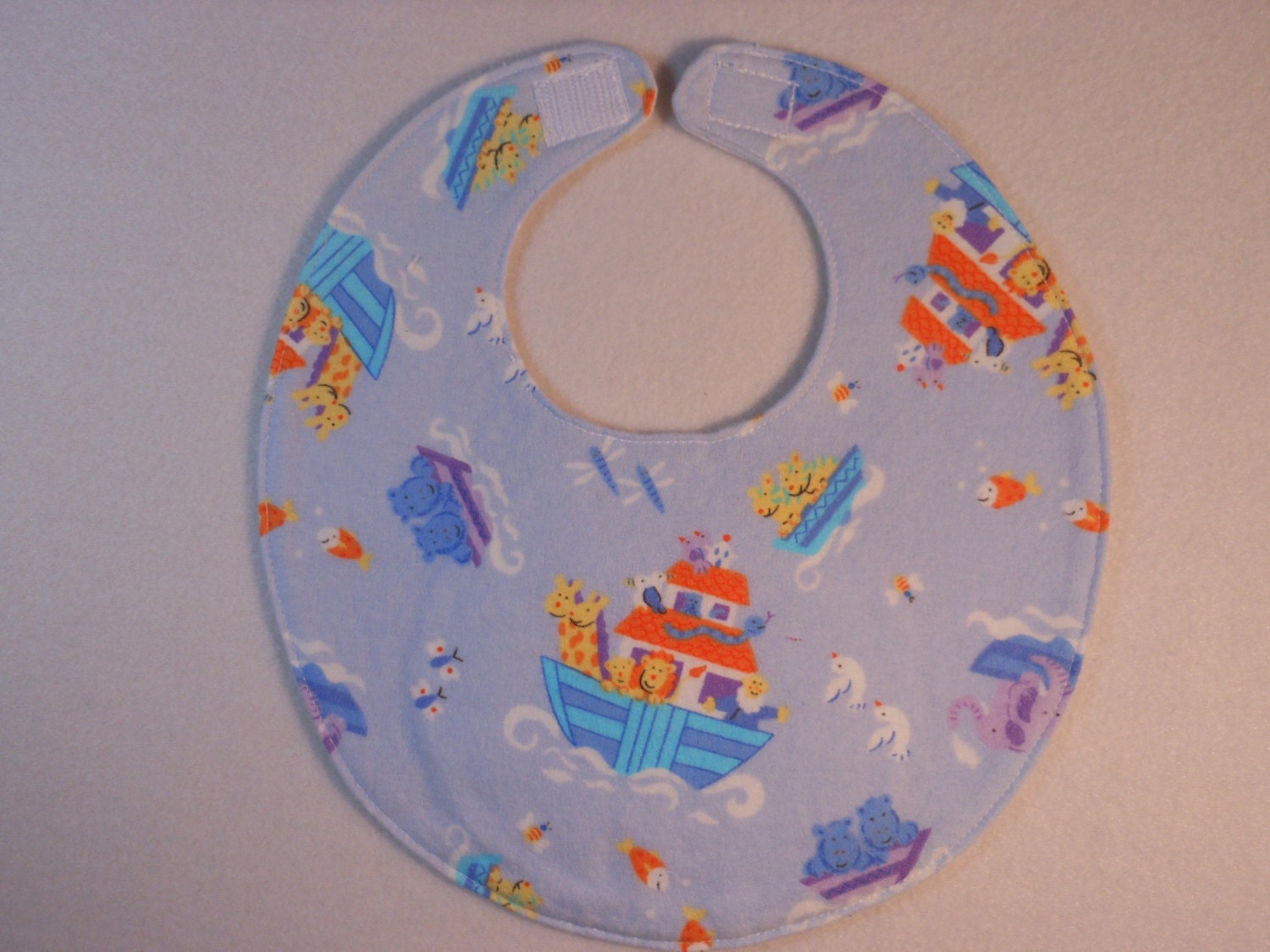 Baby bib, four soft layers, reversible, blue with Noah and friends