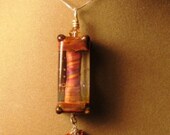 Whirled Peas - Beautiful Bronze Looking Glass Pendant