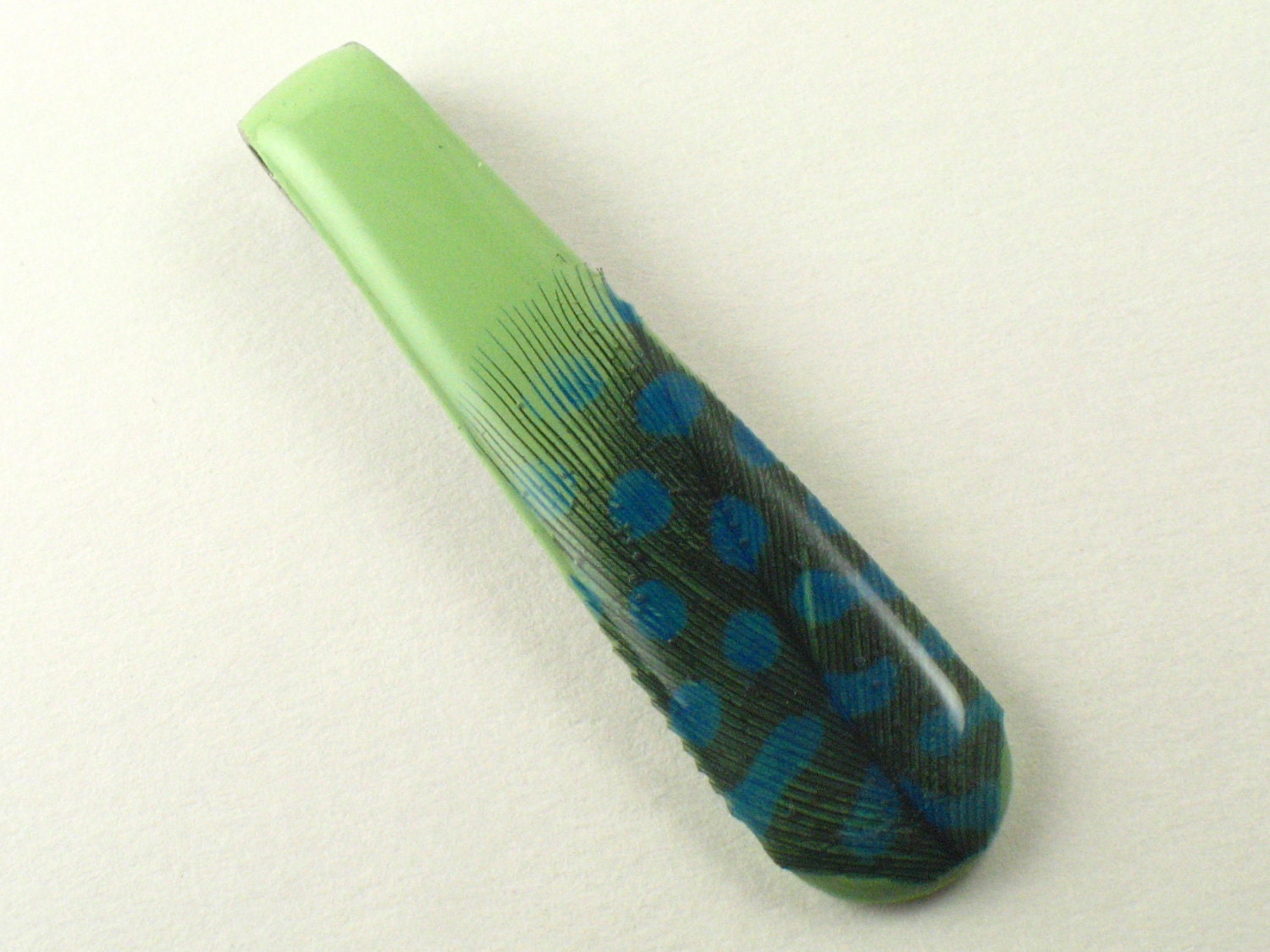 Spoon Handle: green with aqua feather